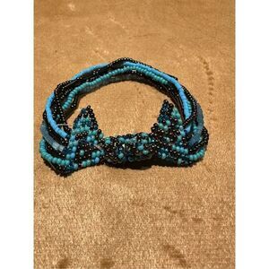 Beaded multi strand bow bracelet